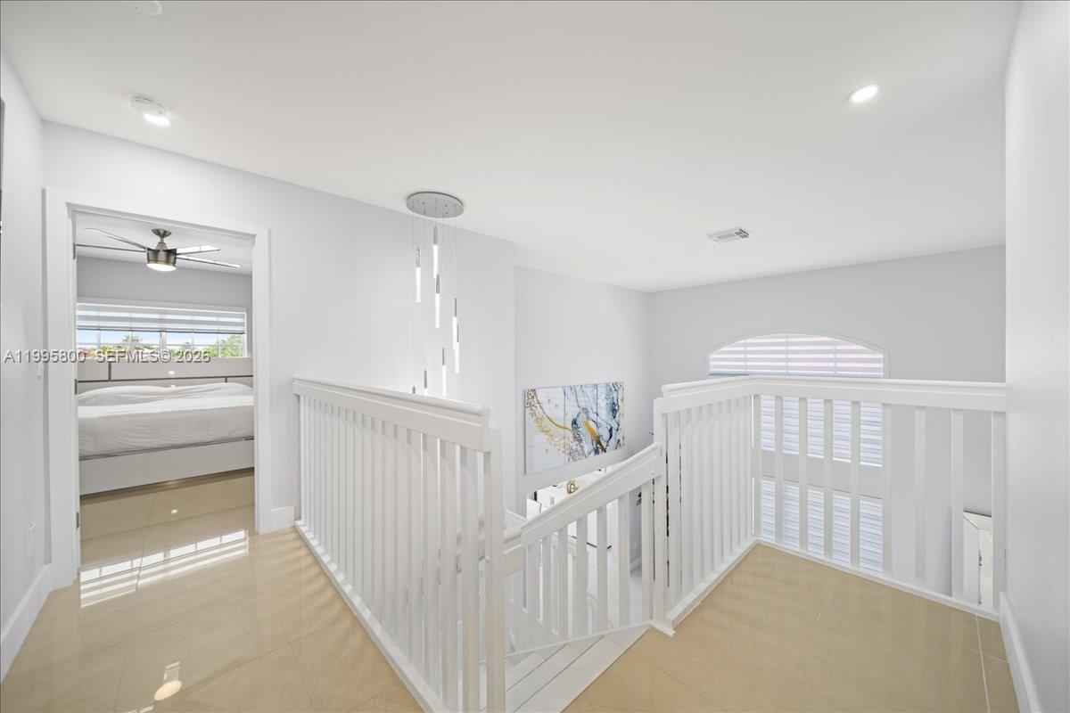 15341 Southwest 36th Street Miami, FL 33185 - Photo 15 of 56 a view of a hallway with windows