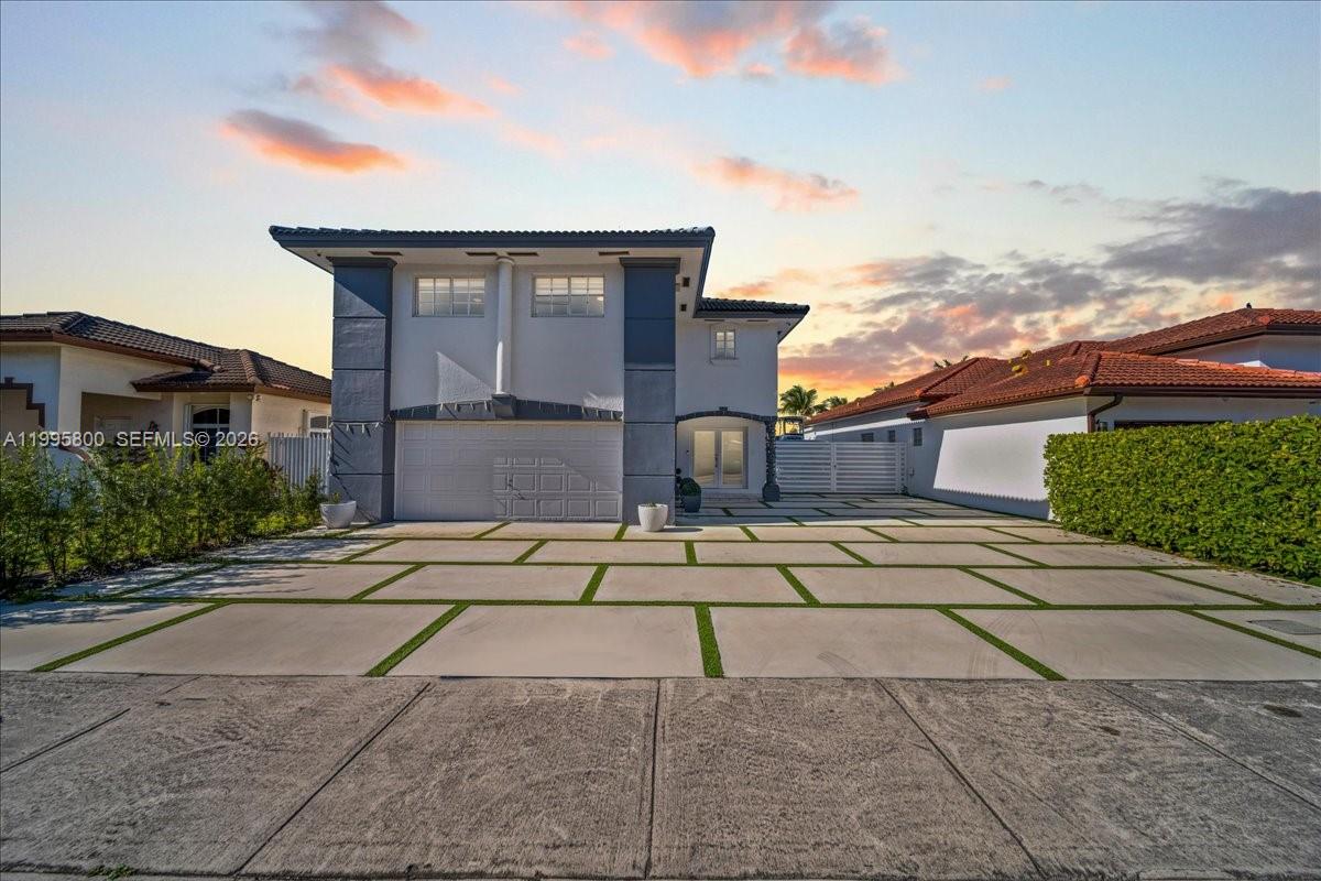 15341 Southwest 36th Street Miami, FL 33185 - Photo 2 of 56 a front view of a house with a yard