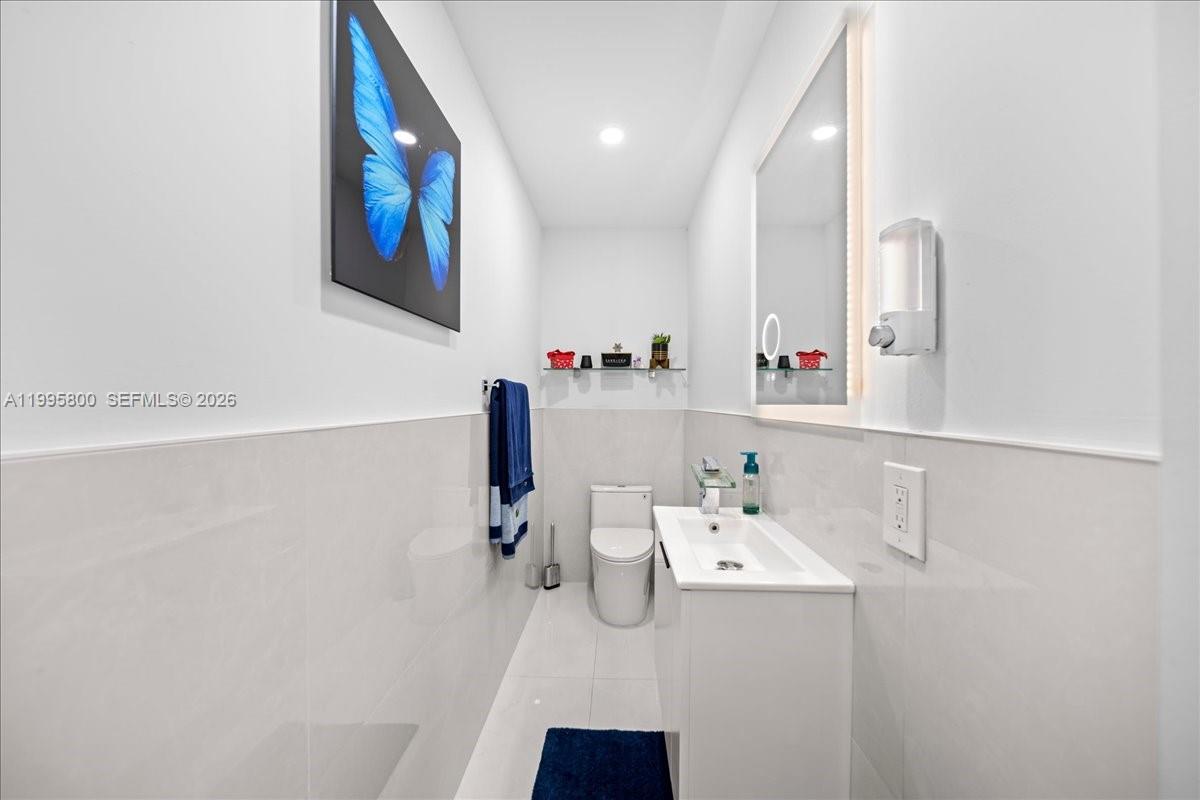 15341 Southwest 36th Street Miami, FL 33185 - Photo 29 of 56 a bathroom with a sink and a mirror