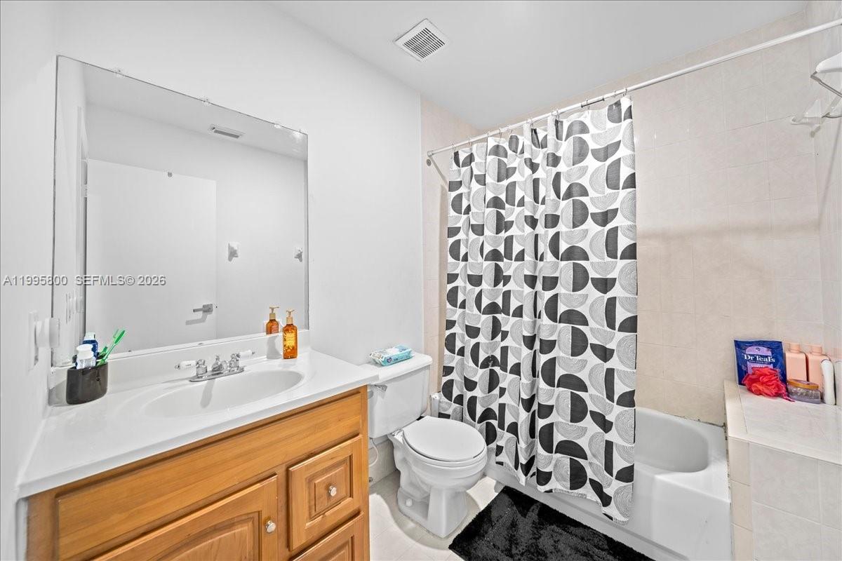 15341 Southwest 36th Street Miami, FL 33185 - Photo 32 of 56 a bathroom with a sink toilet and shower