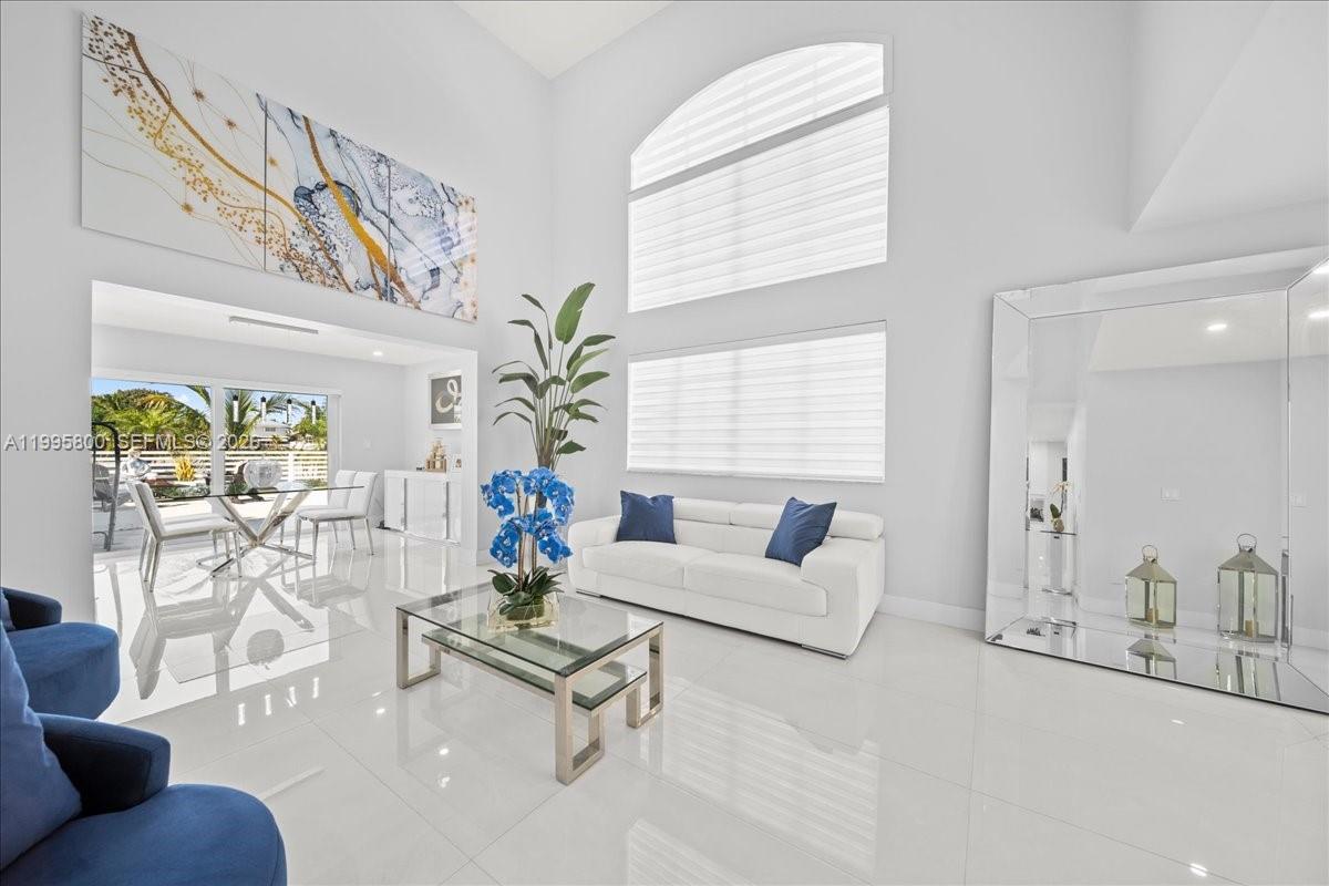 15341 Southwest 36th Street Miami, FL 33185 - Photo 34 of 56 a living room with furniture and a large window