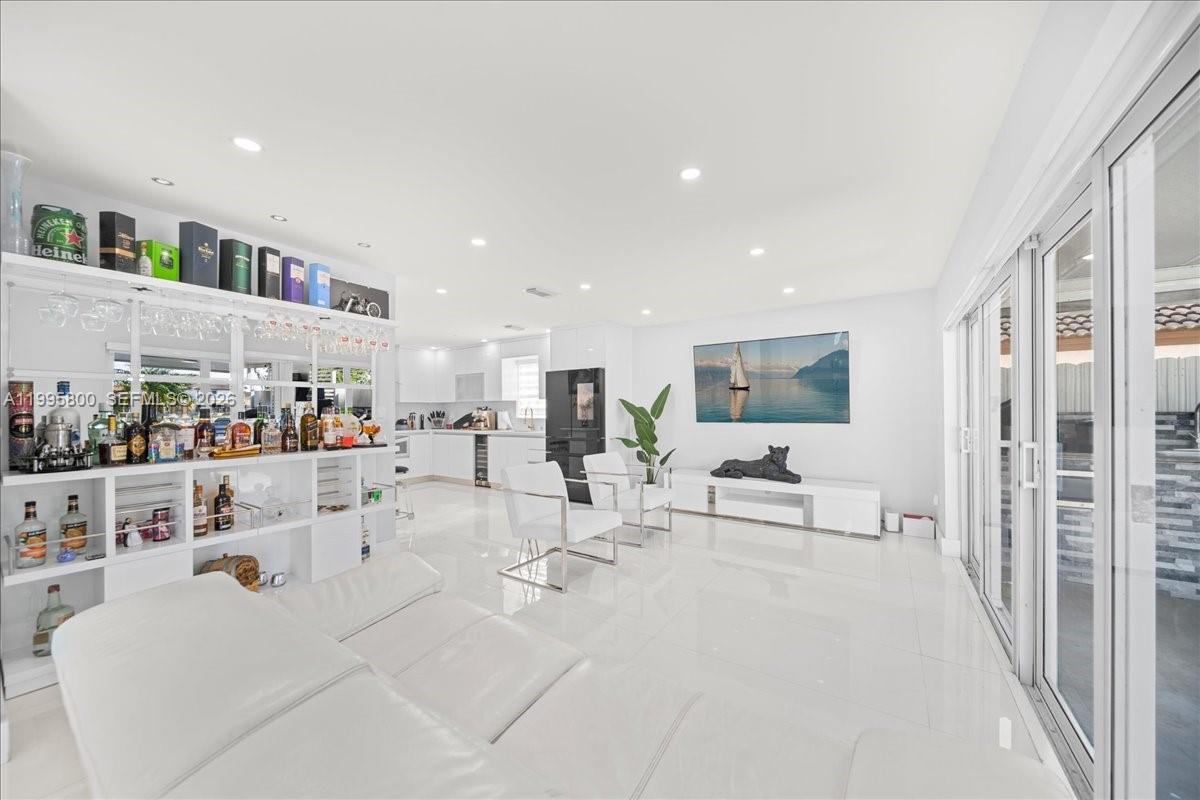 15341 Southwest 36th Street Miami, FL 33185 - Photo 38 of 56 a living room with furniture and a table