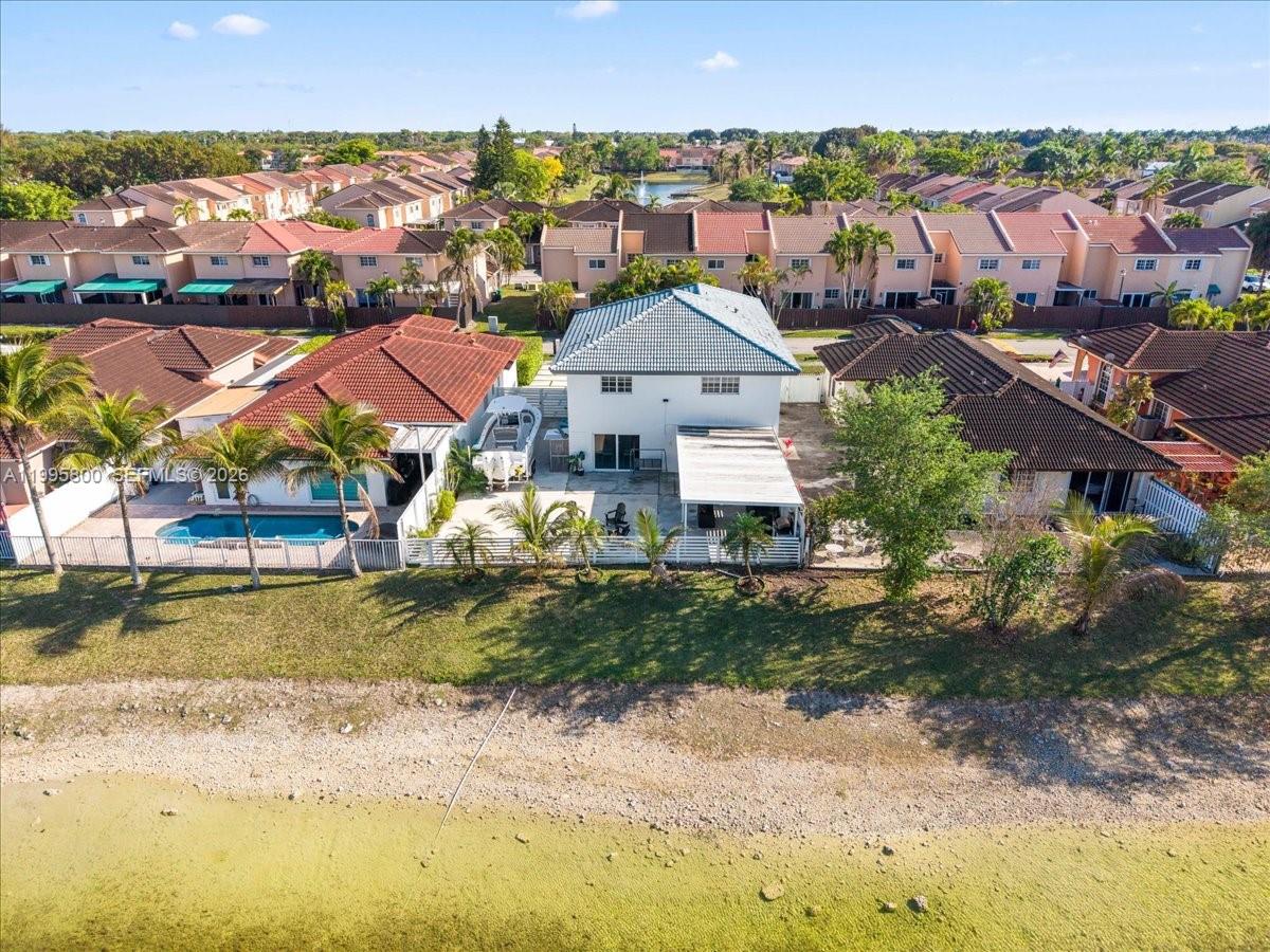 15341 Southwest 36th Street Miami, FL 33185 - Photo 50 of 56 an aerial view of residential houses with outdoor space and swimming pool