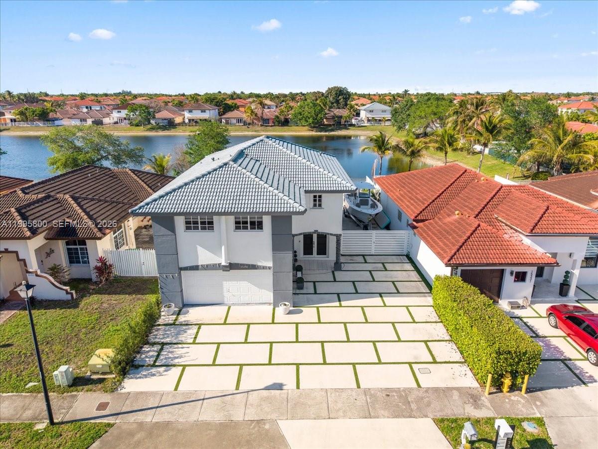 15341 Southwest 36th Street Miami, FL 33185 - Photo 53 of 56 a aerial view of a house with a garden