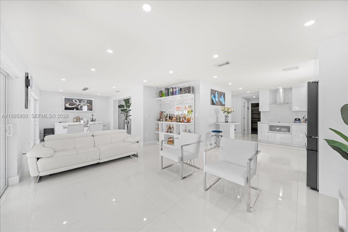 15341 Southwest 36th Street Miami, FL 33185 - Photo 7 of 56 a living room with furniture and white walls