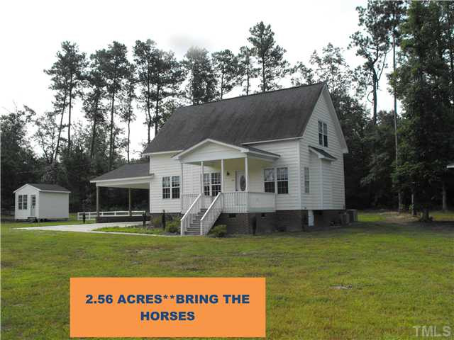 2166 Eldridge Road Newton Grove, NC 28366 - Photo 1 of 11 GORGEOUS TRADITIONAL HOME ON 2.56 ACRES. SET OFF ROAD BRING THE HORSES. Exterior Front