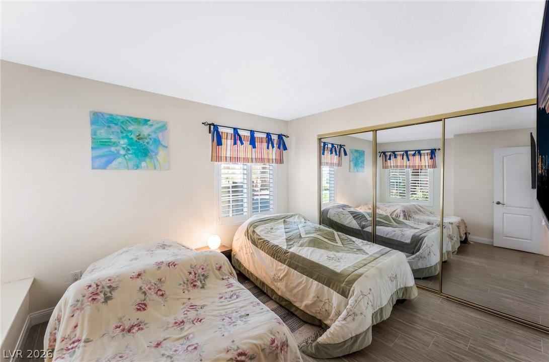3145 East Flamingo Road, Unit 1092 Las Vegas, NV 89121 - Photo 19 of 33 Mirrored closet doors and plantation shutters define this naturally illuminated bedroom.
