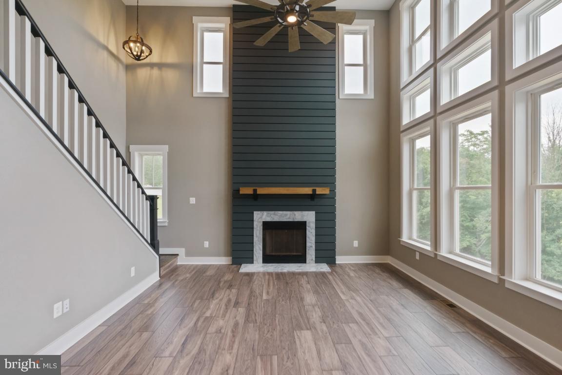 8225 Ball Road Frederick, MD 21704 - Photo 8 of 26 Amazing light with floor to ceiling windows.