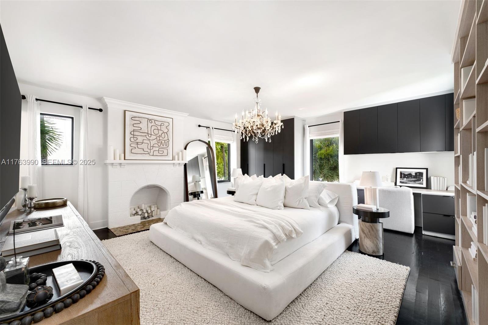 4430 Alton Road Miami Beach, FL 33140 - Photo 24 of 47 a bedroom with a bed and a flat screen tv