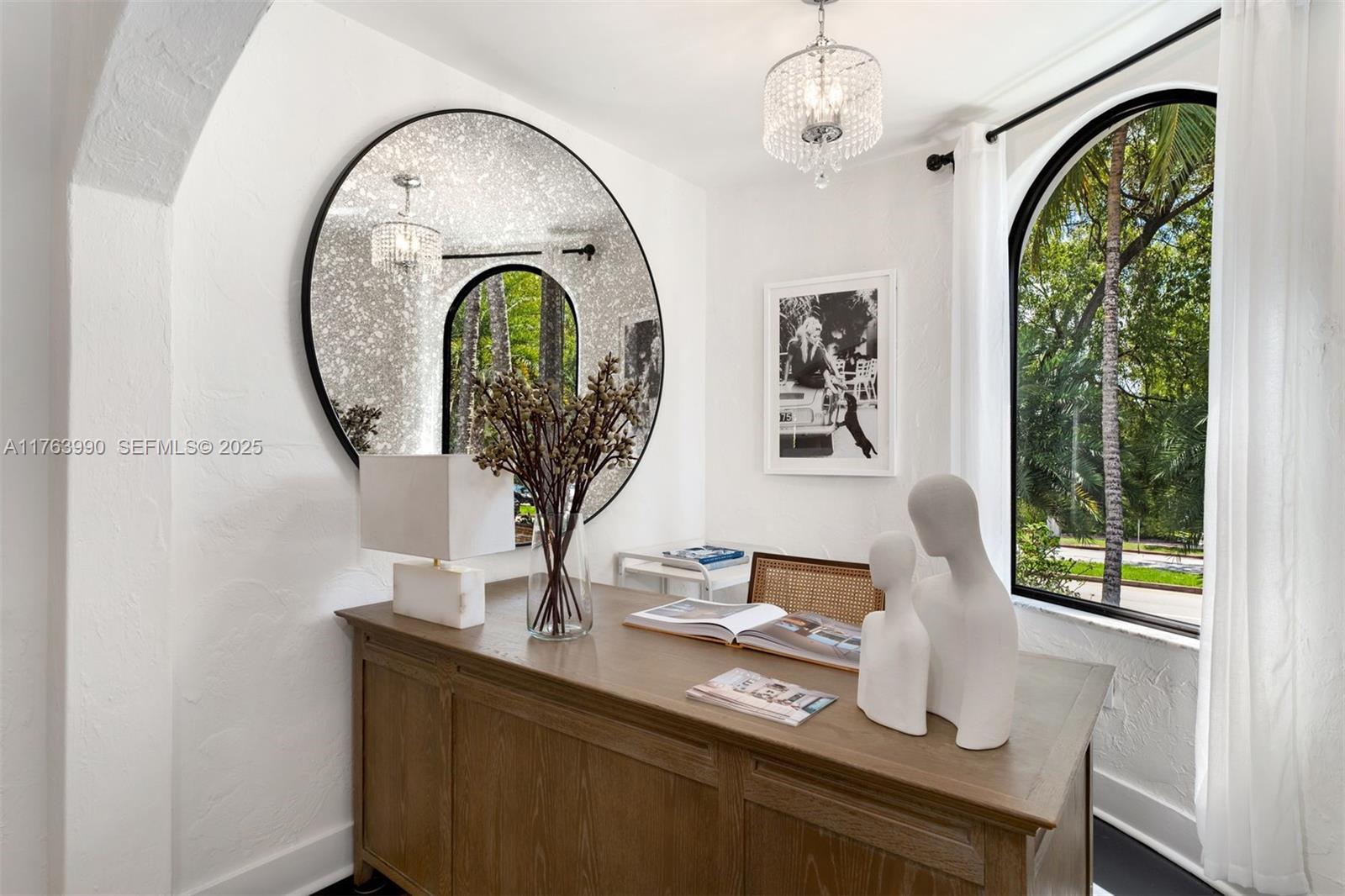 4430 Alton Road Miami Beach, FL 33140 - Photo 28 of 47 a vase of flowers sitting on a table