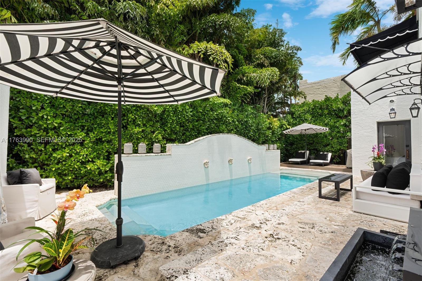4430 Alton Road Miami Beach, FL 33140 - Photo 33 of 47 a view of a chairs and tables in the patio