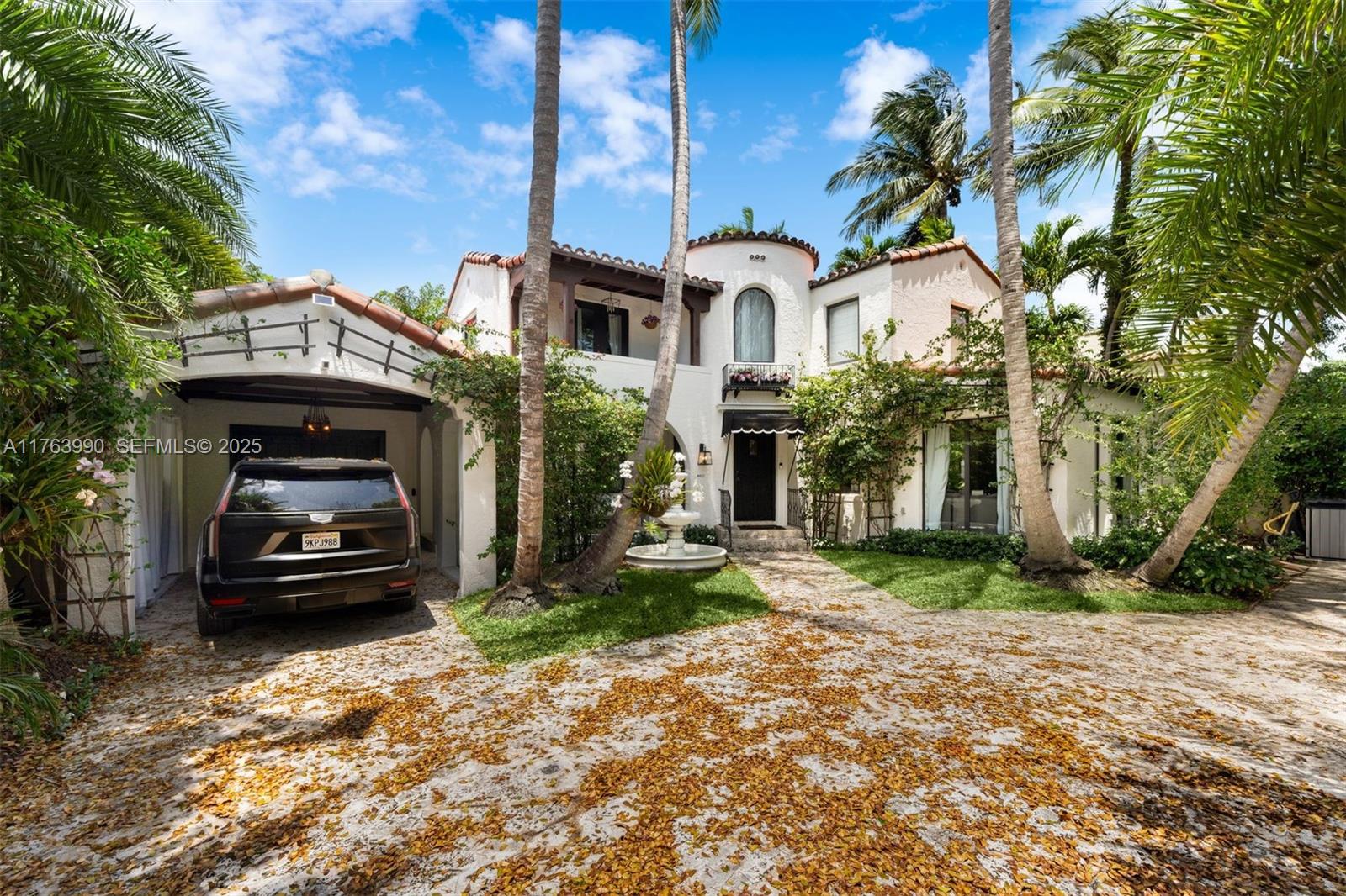 4430 Alton Road Miami Beach, FL 33140 - Photo 43 of 47 a front view of a house with a yard