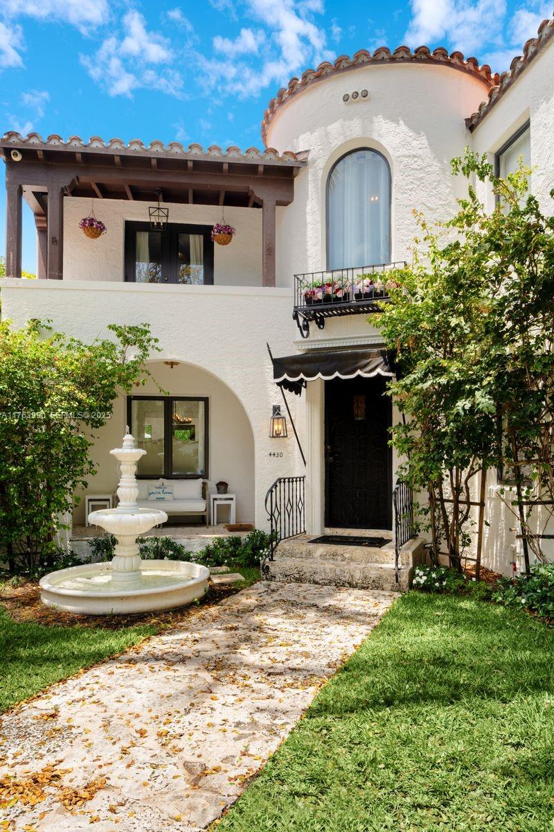4430 Alton Road Miami Beach, FL 33140 - Photo 45 of 47 a front view of a house with garden