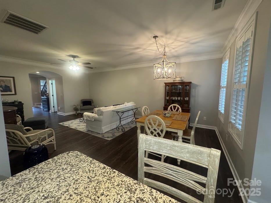 2279 Eversham Drive Northwest Concord, NC 28027 - Photo 11 of 28 a living room with furniture a chandelier and a fireplace