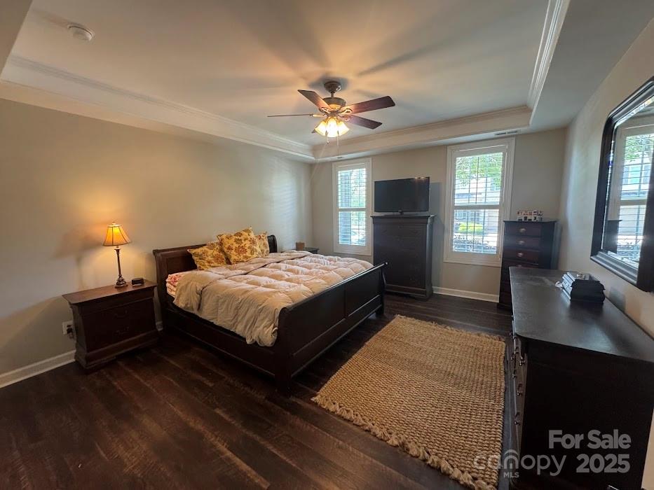 2279 Eversham Drive Northwest Concord, NC 28027 - Photo 13 of 28 a bedroom with a bed and a chandelier