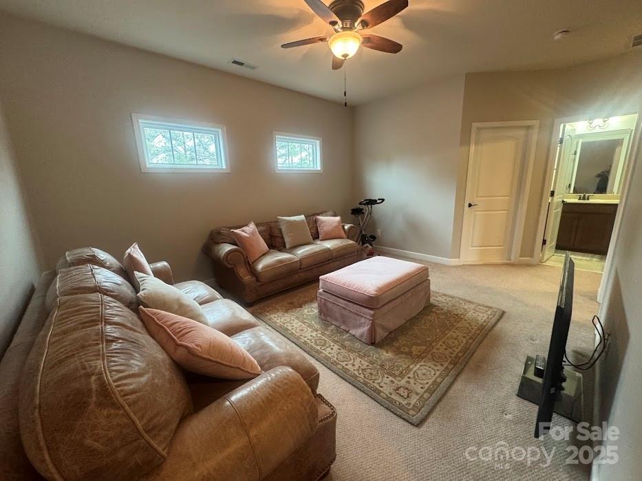 2279 Eversham Drive Northwest Concord, NC 28027 - Photo 18 of 28 a living room with furniture and a lamp