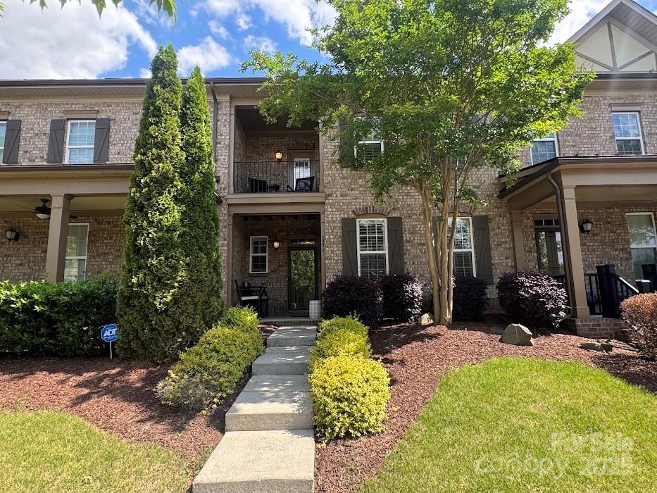 2279 Eversham Drive Northwest Concord, NC 28027 - Photo 28 of 28 a view of a house with sitting area and garden