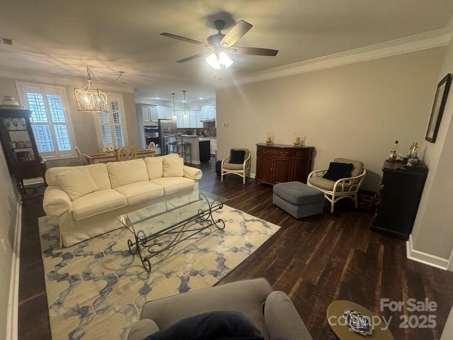 2279 Eversham Drive Northwest Concord, NC 28027 - Photo 5 of 28 a living room with furniture and a chandelier