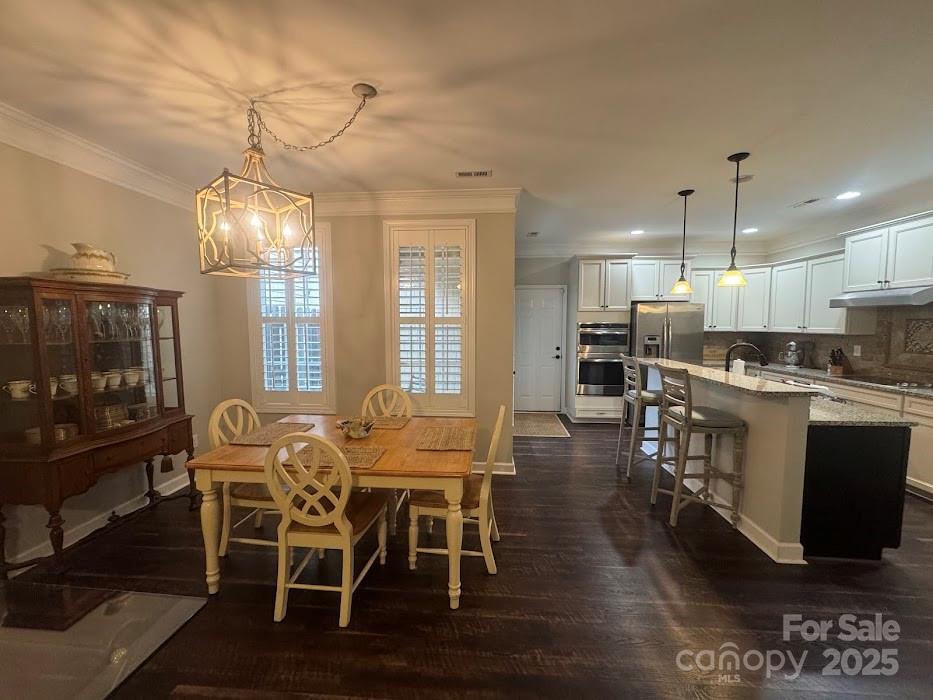 2279 Eversham Drive Northwest Concord, NC 28027 - Photo 6 of 28 a view of a dining room with furniture window and wooden floor