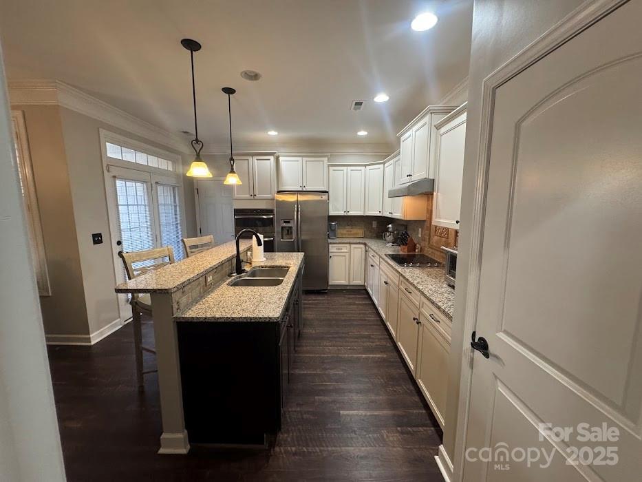 2279 Eversham Drive Northwest Concord, NC 28027 - Photo 10 of 28 a kitchen with kitchen island a sink stove and refrigerator