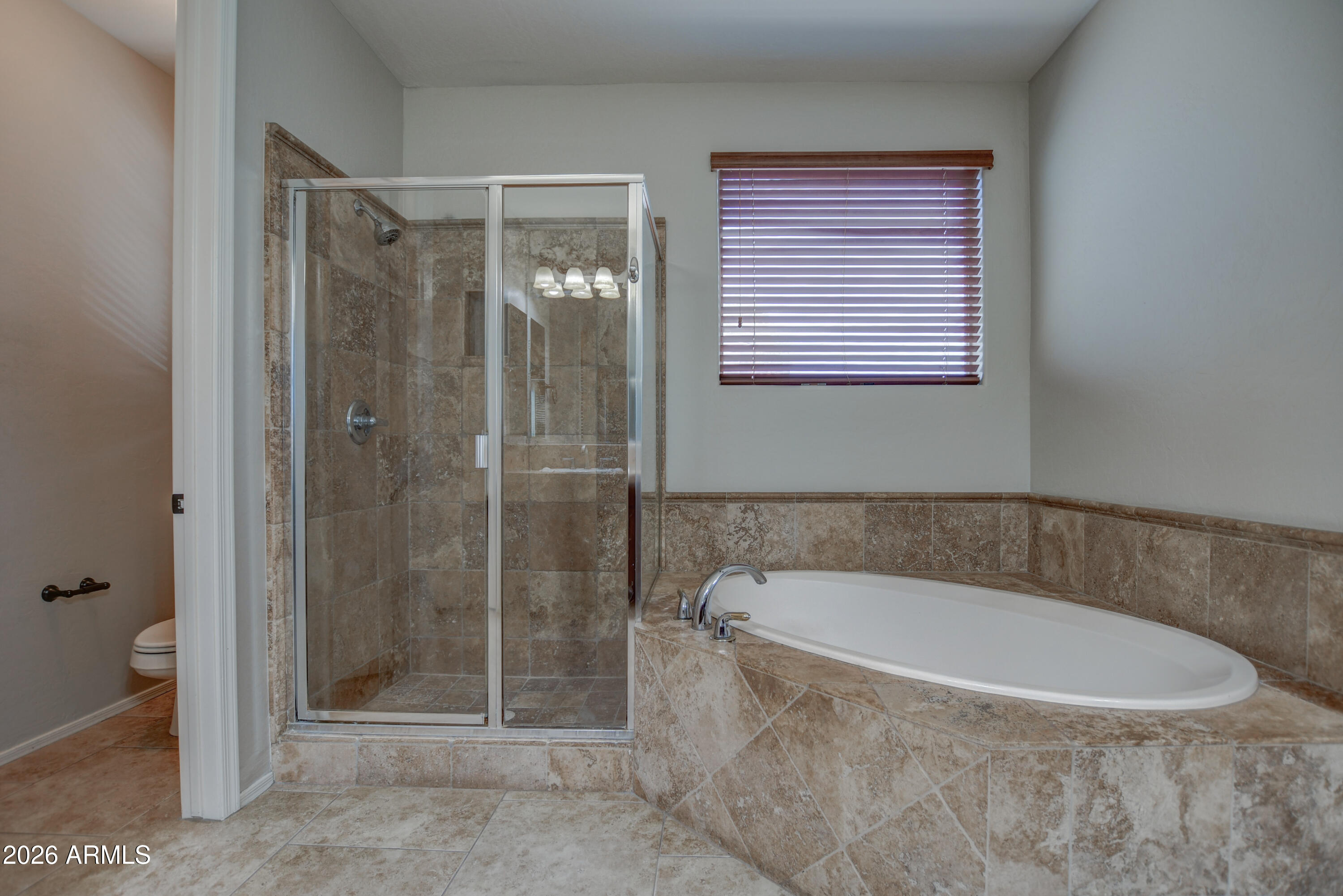 3078 East Muirfield Street Gilbert, AZ 85298 - Photo 68 of 92 a bathroom with a shower and a bathtub