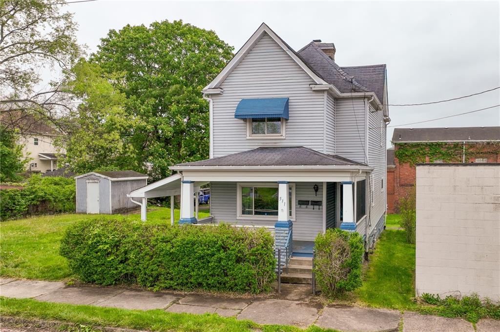 511 2nd Street Monessen, PA 15062 - Photo 1 of 21 a front view of a house with a yard and potted plants