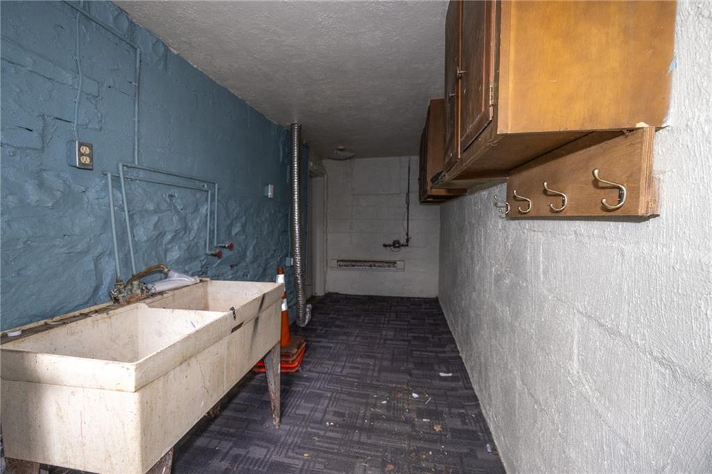 511 2nd Street Monessen, PA 15062 - Photo 17 of 21 a bathroom with a tub sink and mirror