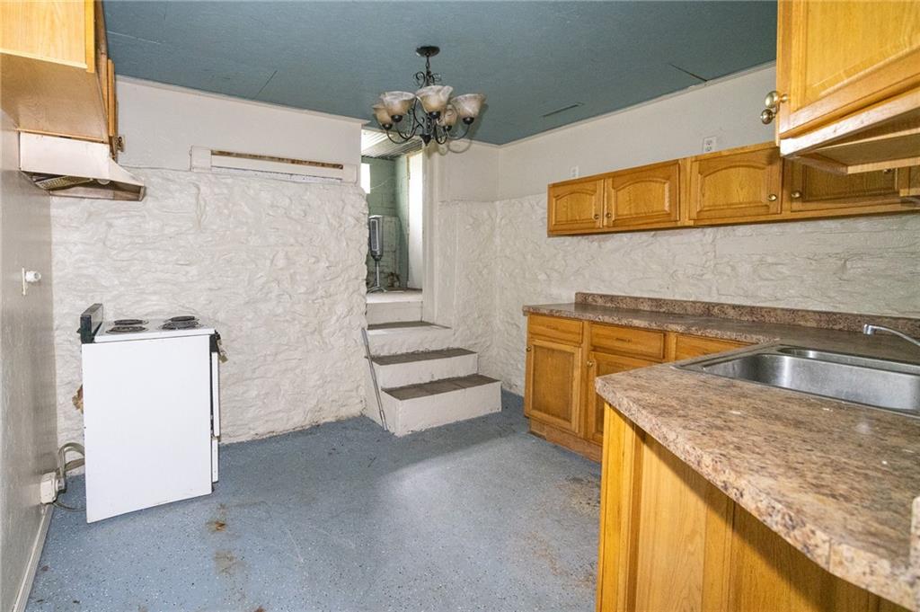 511 2nd Street Monessen, PA 15062 - Photo 18 of 21 a kitchen with a sink and a stove top oven