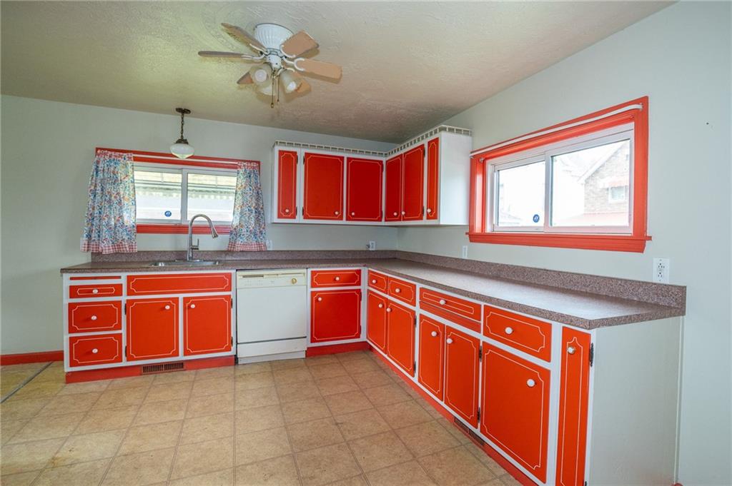 511 2nd Street Monessen, PA 15062 - Photo 4 of 21 a kitchen with stainless steel appliances granite countertop a stove sink and cabinets