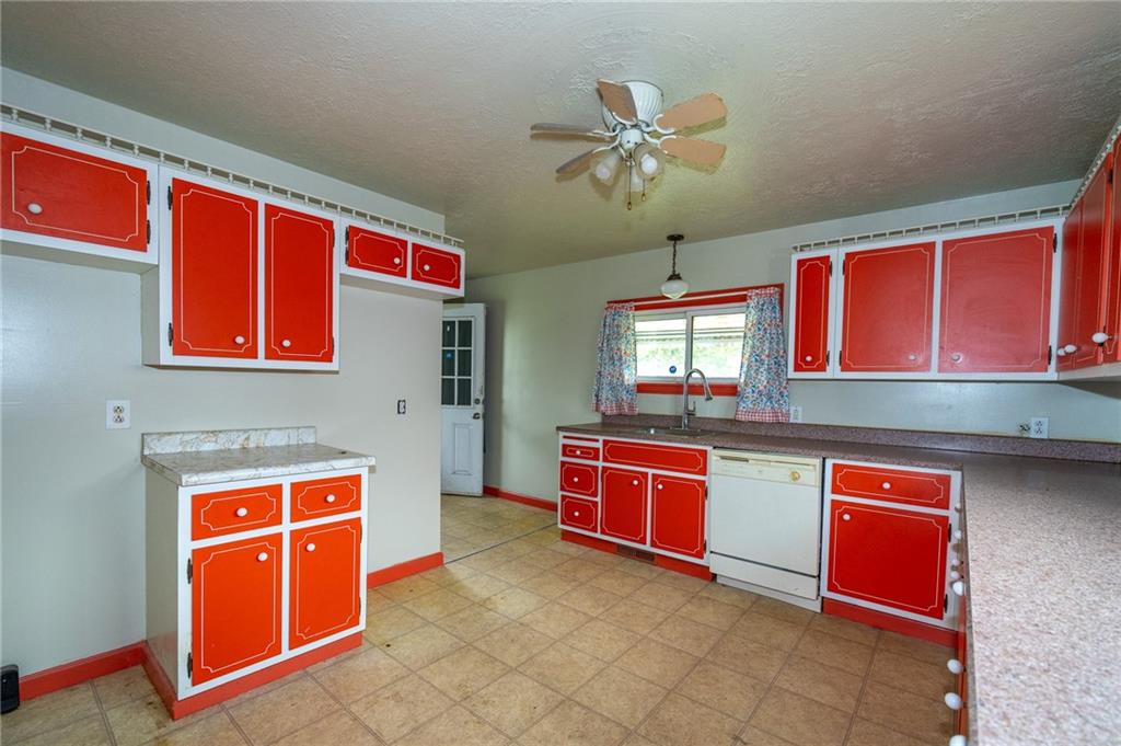 511 2nd Street Monessen, PA 15062 - Photo 5 of 21 a kitchen with stainless steel appliances granite countertop a stove and cabinets