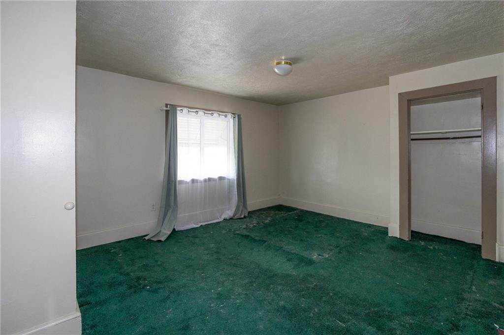 511 2nd Street Monessen, PA 15062 - Photo 9 of 21 a view of an empty room with closet and windows