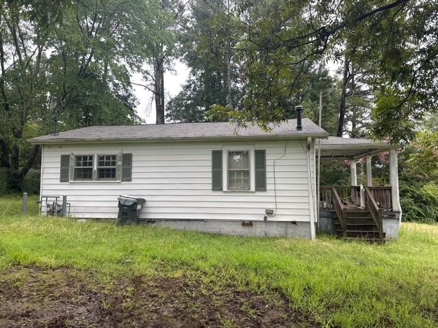 2223 Pine Mountain Road Northwest Kennesaw, GA 30152 - Photo 1 of 1 a front view of house with yard and outdoor seating