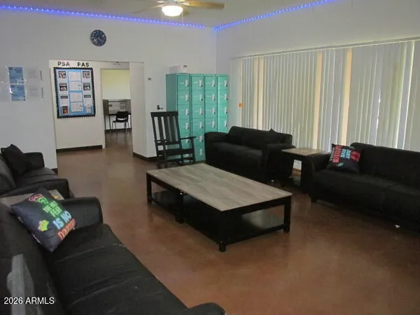 a living room with furniture and a window