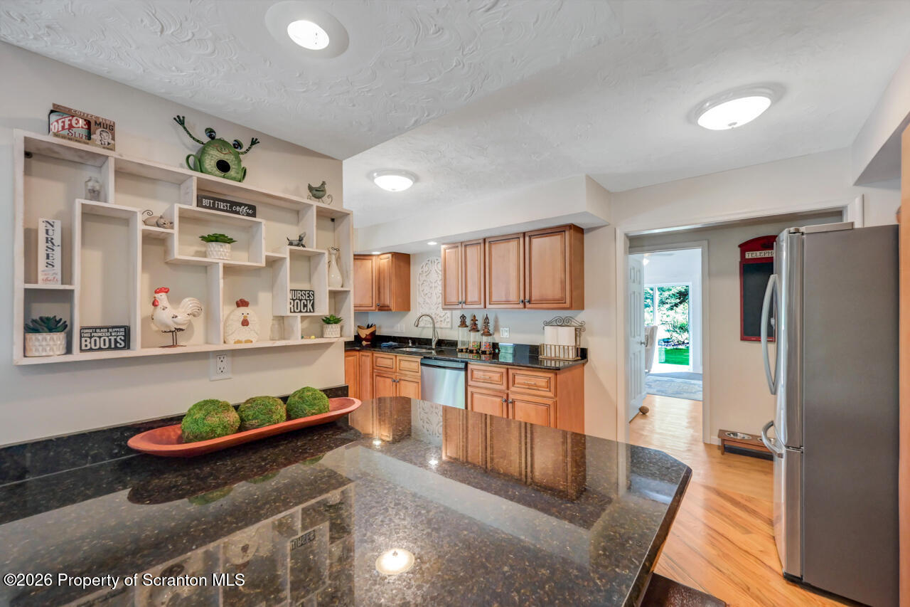 3660 Aberdeen Road Moscow, PA 18444 - Photo 24 of 68 a kitchen with stainless steel appliances granite countertop a refrigerator and a stove top oven
