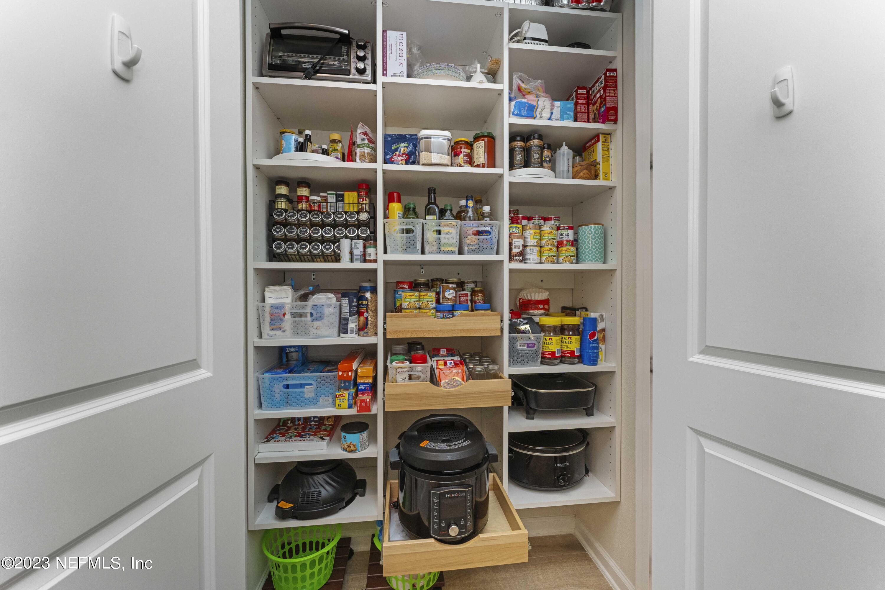 515 Park Forest Drive Ponte Vedra, FL 32081 - Photo 20 of 106 a shelf with books and knick knacks on it