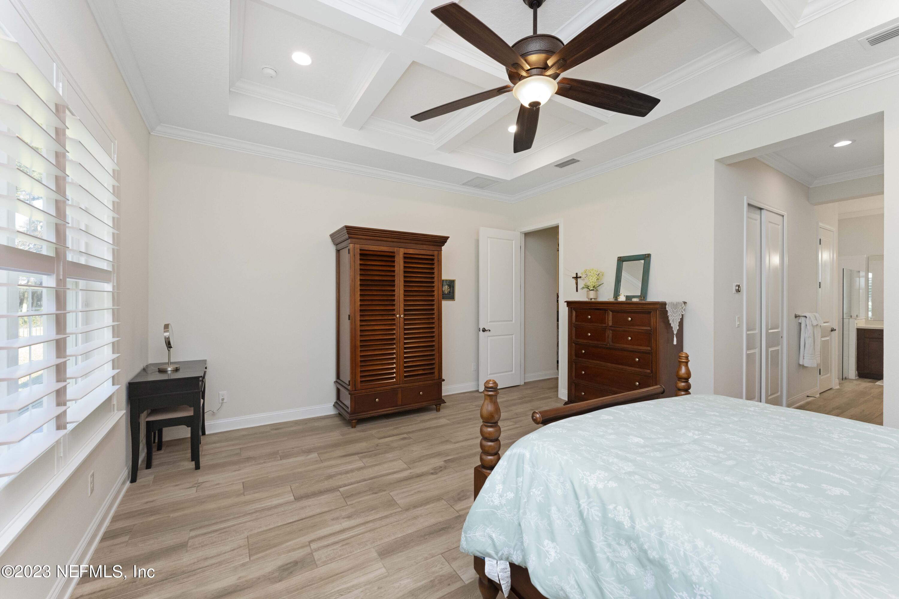 515 Park Forest Drive Ponte Vedra, FL 32081 - Photo 24 of 106 a bedroom with a bed closet and a ceiling fan