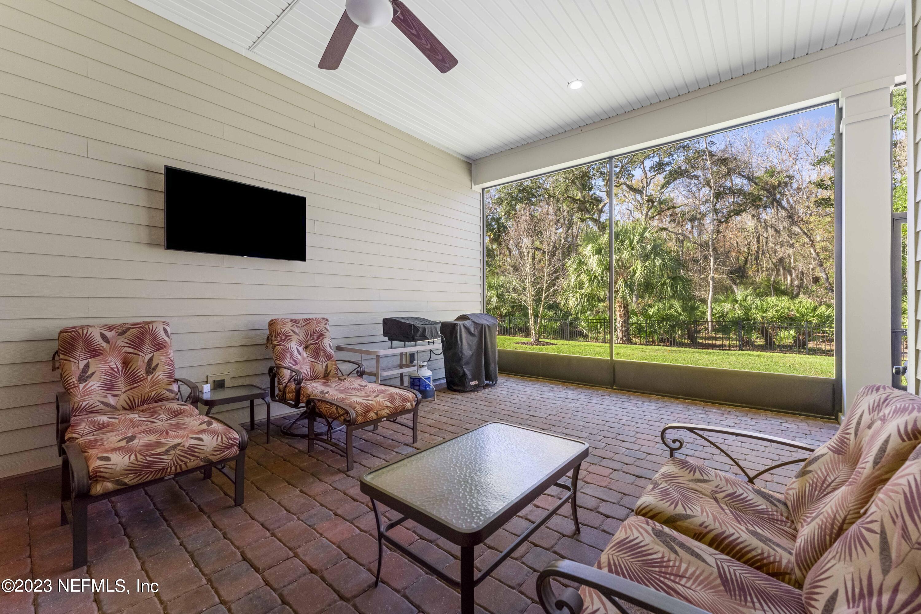 515 Park Forest Drive Ponte Vedra, FL 32081 - Photo 38 of 106 a living room with furniture and a flat screen tv