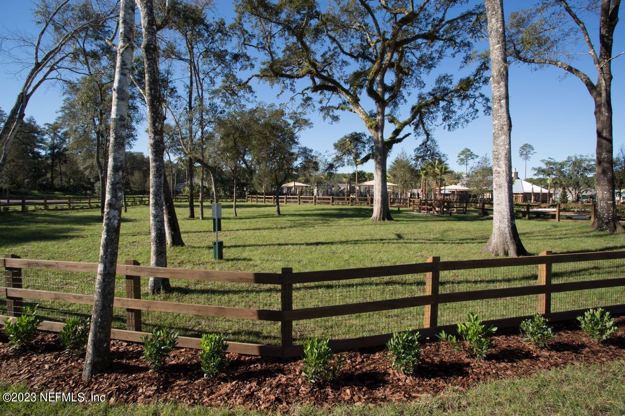 515 Park Forest Drive Ponte Vedra, FL 32081 - Photo 75 of 106 a view of a park with lots of flower plants and wooden fence