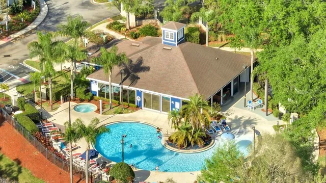 a terrace with outdoor seating and trees