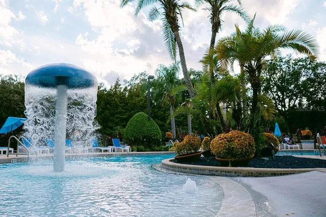 an aerial view of a house with swimming pool garden and patio