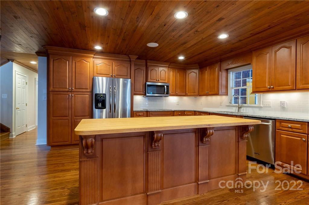 200 Range Road Kings Mountain, NC 28086 - Photo 16 of 45 a kitchen with stainless steel appliances granite countertop a sink refrigerator and cabinets