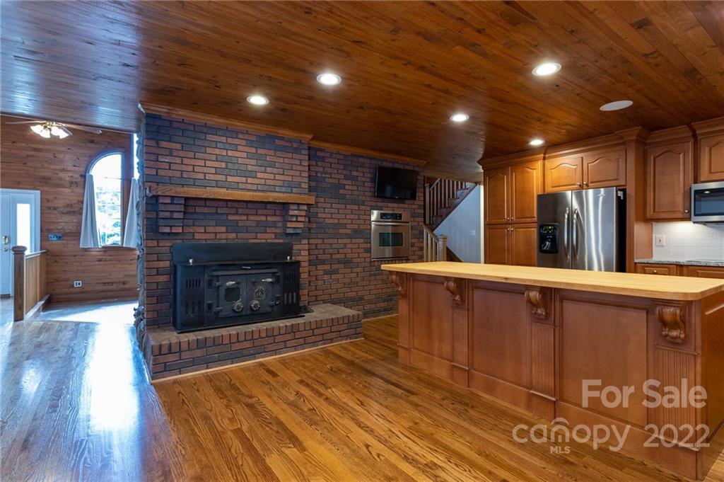 200 Range Road Kings Mountain, NC 28086 - Photo 17 of 45 a view of kitchen with fireplace and wooden floor