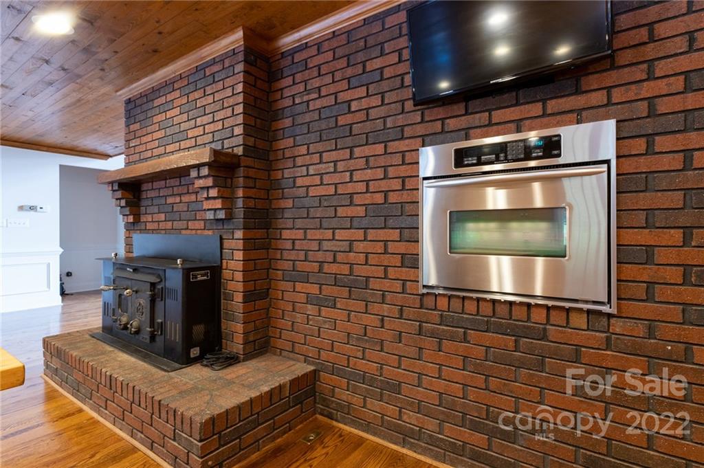 200 Range Road Kings Mountain, NC 28086 - Photo 18 of 45 a kitchen with granite countertop a stove and a microwave