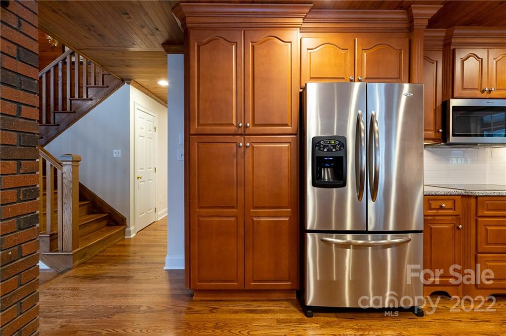 200 Range Road Kings Mountain, NC 28086 - Photo 19 of 45 a view of a refrigerator in kitchen and wooden floor