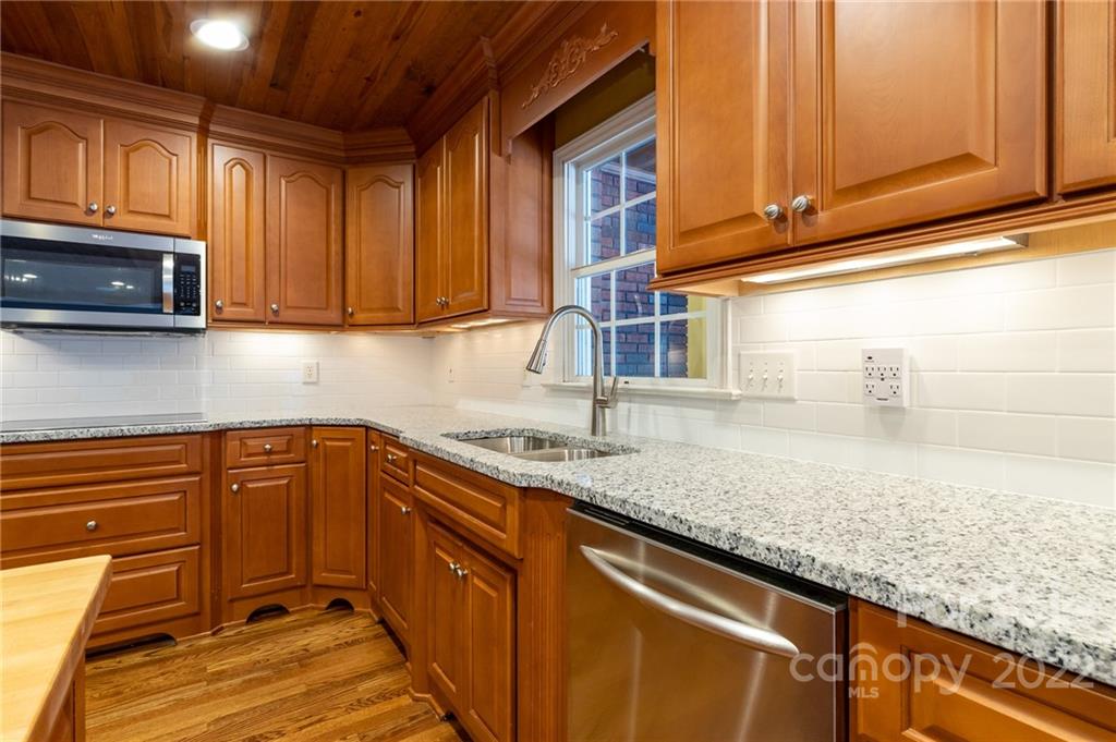 200 Range Road Kings Mountain, NC 28086 - Photo 21 of 45 a kitchen with stainless steel appliances granite countertop wooden cabinets a sink and dishwasher