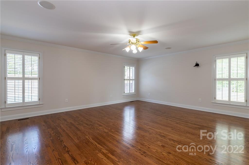 200 Range Road Kings Mountain, NC 28086 - Photo 22 of 45 an empty room with wooden floor and windows