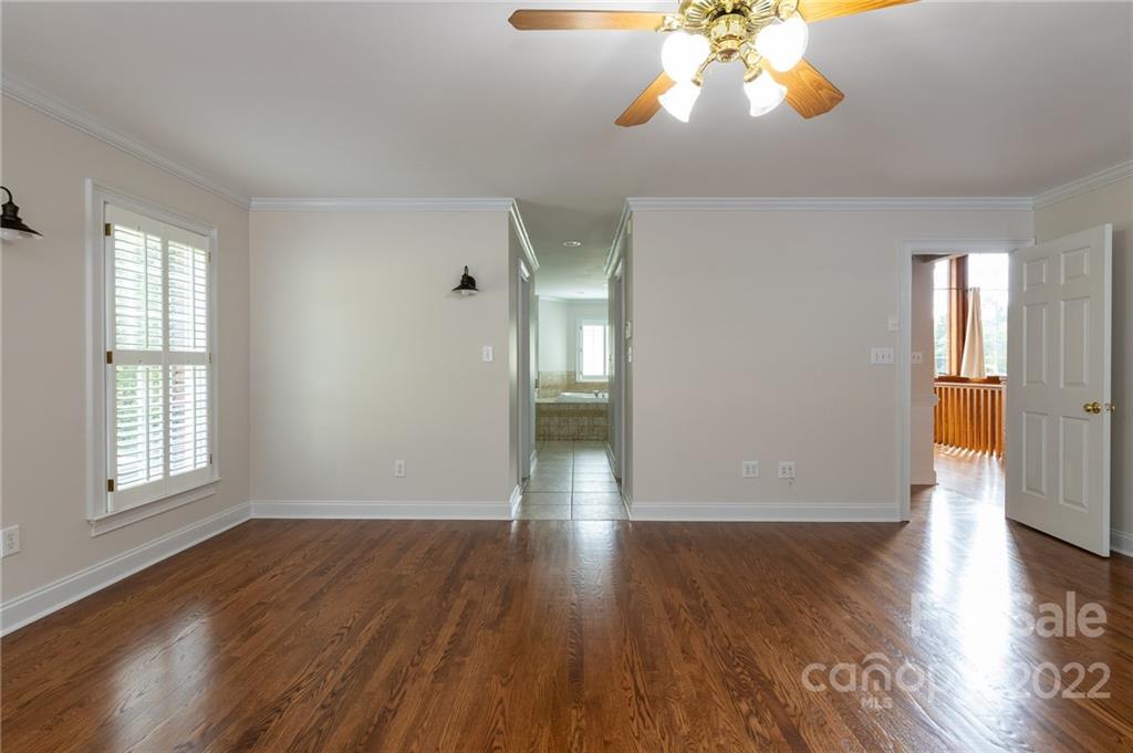 200 Range Road Kings Mountain, NC 28086 - Photo 23 of 45 a view of empty room with wooden floor and fan