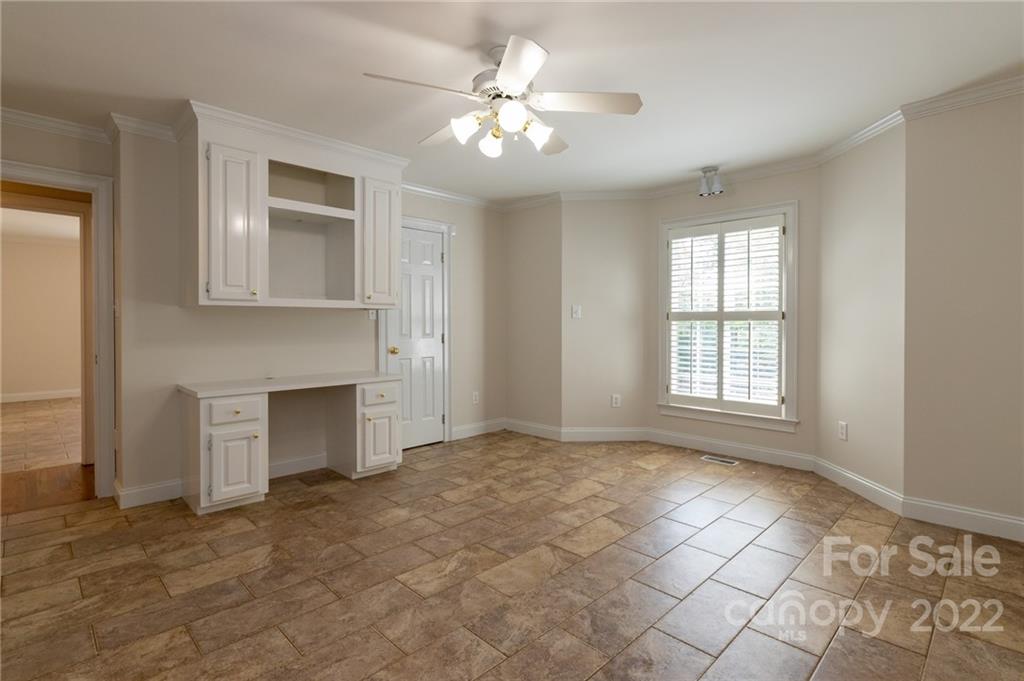 200 Range Road Kings Mountain, NC 28086 - Photo 27 of 45 a view of an empty room with a fireplace and a window