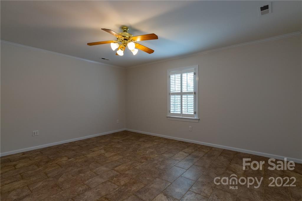 200 Range Road Kings Mountain, NC 28086 - Photo 35 of 45 an empty room with windows and fan