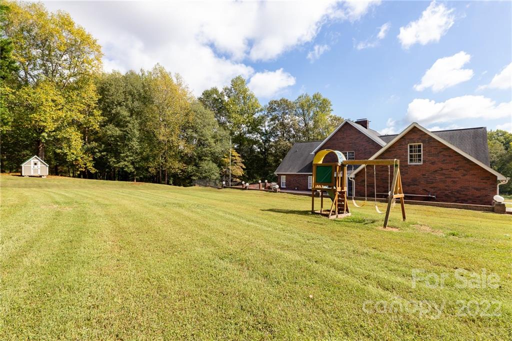 200 Range Road Kings Mountain, NC 28086 - Photo 42 of 45 a view of an house with backyard and tree